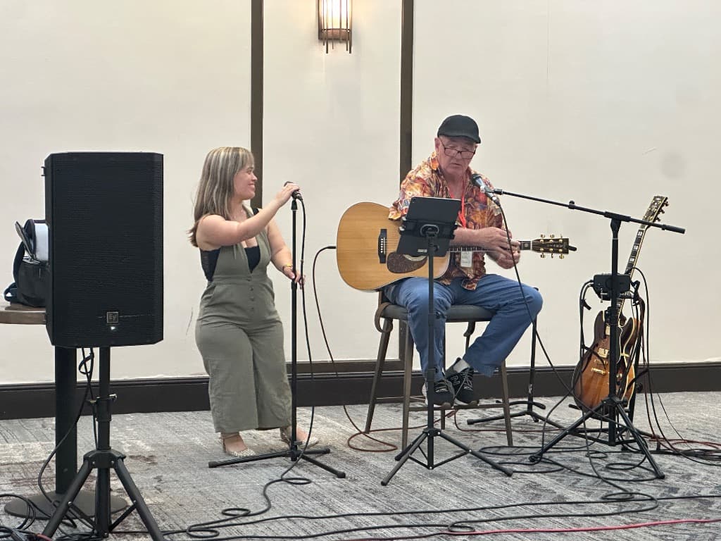 The Zach & Lyndsey Show performing live on stage at the LPA District 1 Regional in Vermont